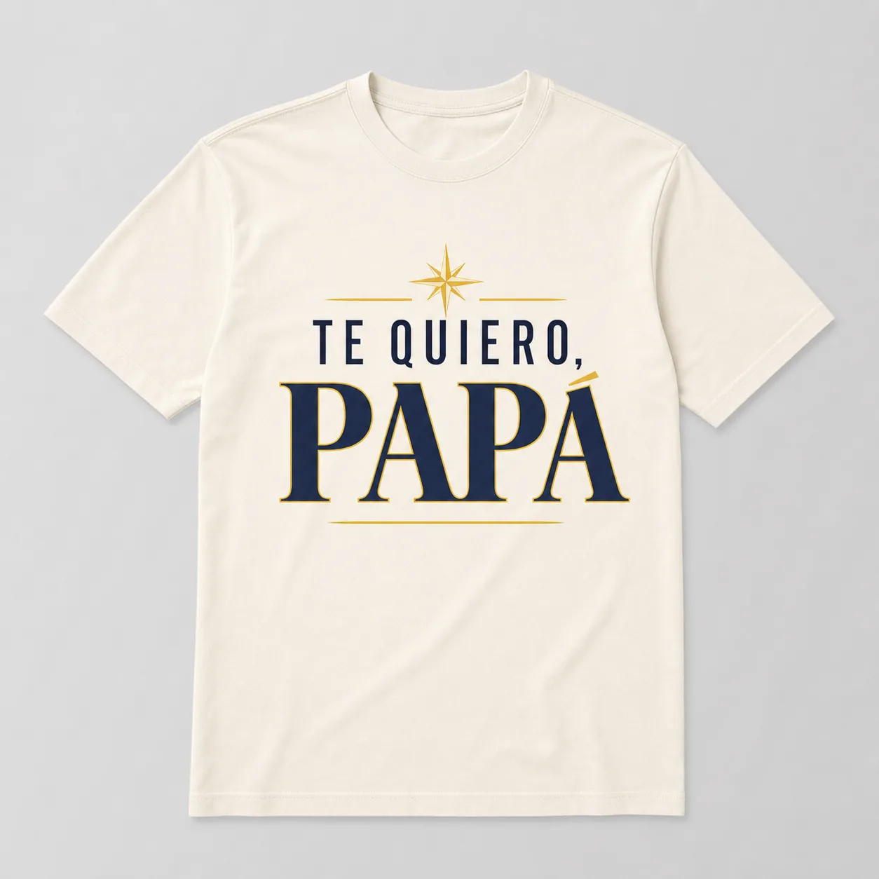 Camiseta Cream con el estampado «Te Quiero, Papá»: una estrella dorada sobre el texto azul, subrayado en dorado.